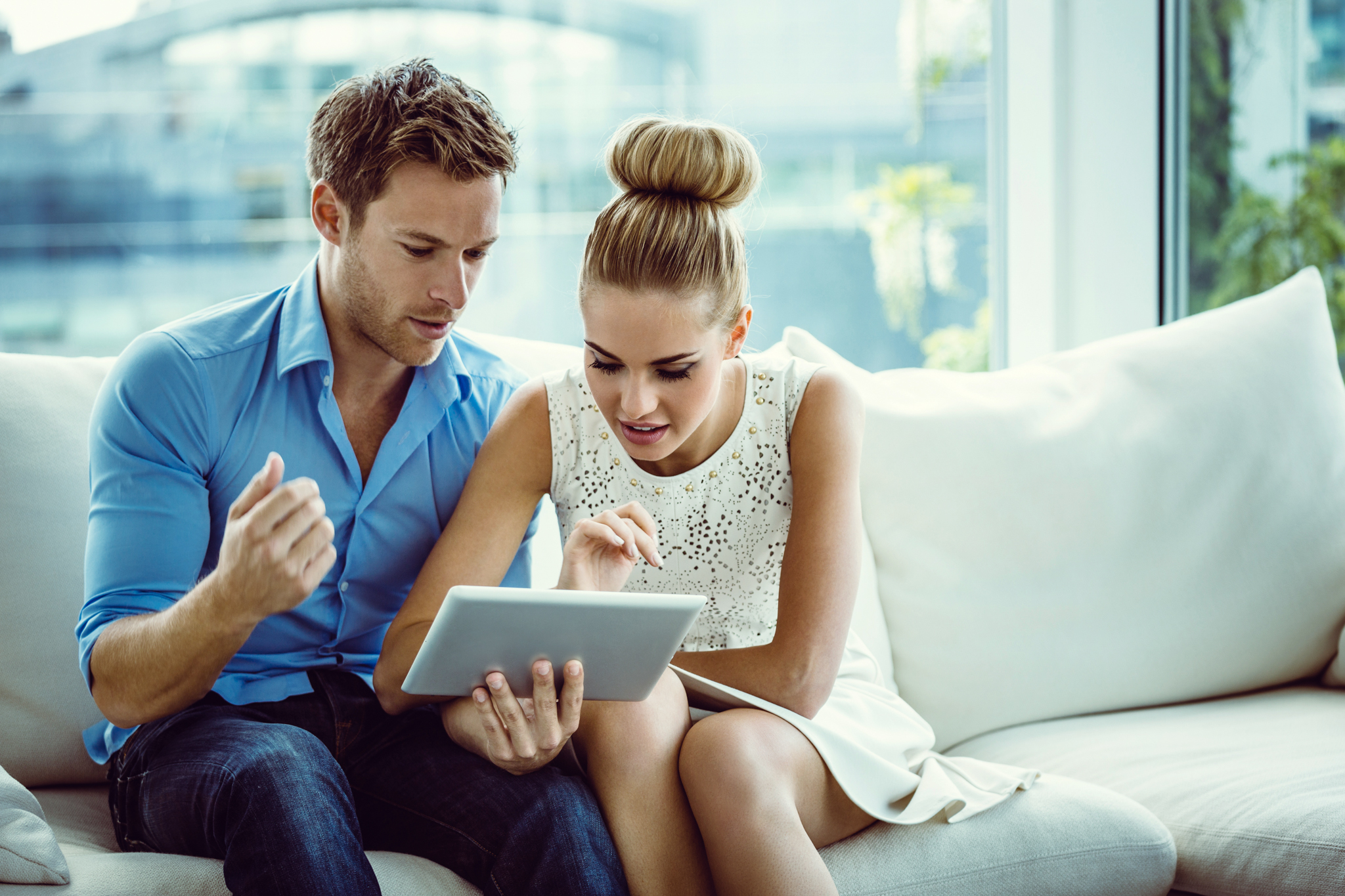 Couple using a digital tablet